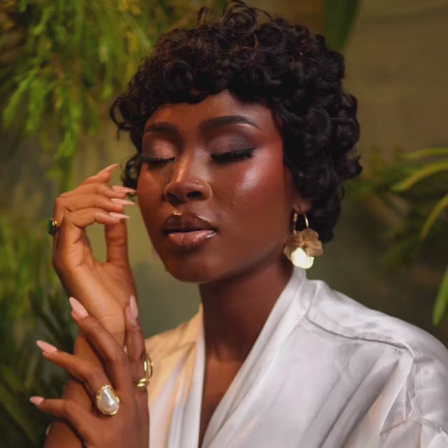 various shots of a woman in the Tress To Go muse wig posing and looking peaceful